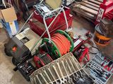 a picture of a pile of tools and tools in a garage