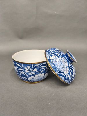 an image of a blue and white bowl sitting on top of a table