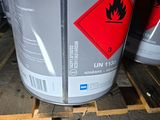 a can of uni135 on a pallet next to a pallet of uni135