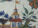 a picture of a decorative plate with birds and flowers on it