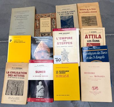 several books are stacked on top of each other on the floor