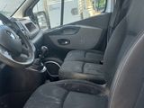 the interior of a van with the door open and the driver ' s seat down