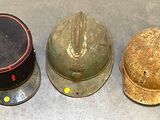three helmets sitting next to each other on the floor