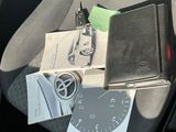 a car seat with a clock and other items in it