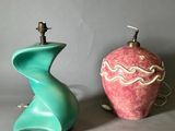 two vases sitting next to each other on a table