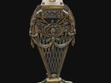 an image of a gold and silver vase on a black background
