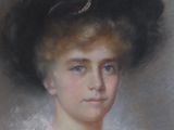 portrait of a woman with a black hat and a white dress