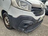 the front end of a van with a denting front bumper
