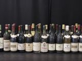 many bottles of wine lined up on a table