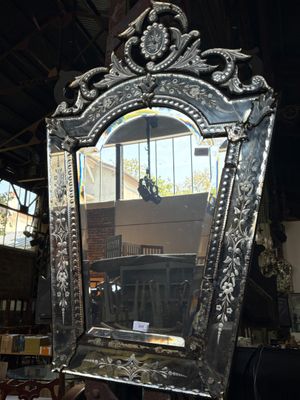 a mirror that is sitting on a table in a room