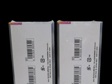 two boxes with a barcode on them on a black background