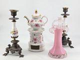 three different vases and a teapot on a white background
