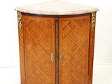 an image of a corner cabinet with marble top