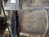 a small brush that is being used to clean a machine