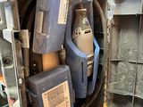 a box full of tools that are sitting on the floor