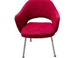 the red chair is sitting on the metal legs of the chair