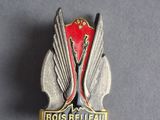 a close up of a badge on a gray surface