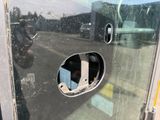 a hole in the side of a bus door