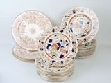several plates are stacked on top of each other on a white surface