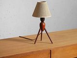 a lamp that is sitting on top of a dresser