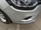 a close up of a car ' s headlight and front bumper