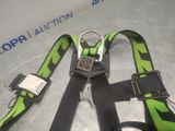 a green and black harness with a metal buckle