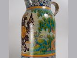 a large vase with a painting on the side of it