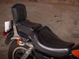 a black and red motorcycle parked in a garage