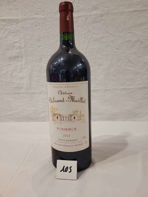a bottle of wine that is sitting on a table