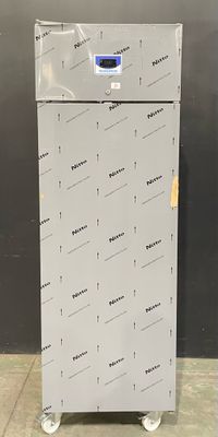 an image of a refrigerator that is in a room