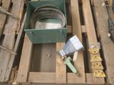 a box of tools sitting on top of a pallet