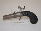 an old gun that is on display on a table
