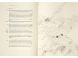 an open book with a drawing of a map on it