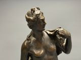 bronze statue of a woman holding a baby in her arms