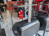 an image of a row of tread machines in a gym
