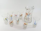 a lot of glasses and a pitcher on the table
