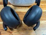 a pair of headphones sitting on a wooden table
