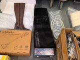 boxes of clothing and other items are on the floor in a store