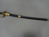 an image of a sword that is on a table