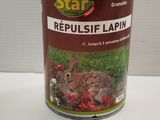 une boîte de « Repulsif Lapin » posée sur une table
