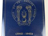 a close up of a blue book with a gold seal on it