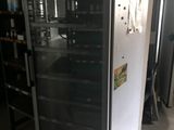 an image of a refrigerator in a kitchen with a lot of shelves