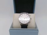 a watch that is in a box on the table