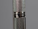 a close up view of a metal pen with a metal cap