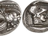 a silver coin with an image of a man and a woman on it