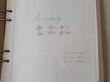 an open book with writing on it sitting on a table