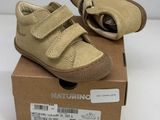 baby boy ' s shoes in a box on a white surface