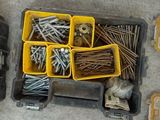 many different types of screws and nuts in the box