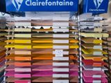 a lot of boxes of different colors on the shelves