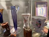 many vases on display in a glass case